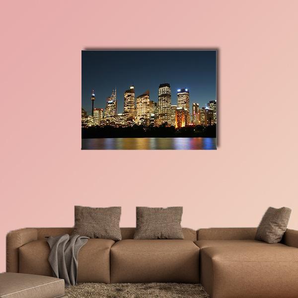 Sydney City Skyline at Night Canvas Wall Art in black, yellow and blue, single panel hung on a wall