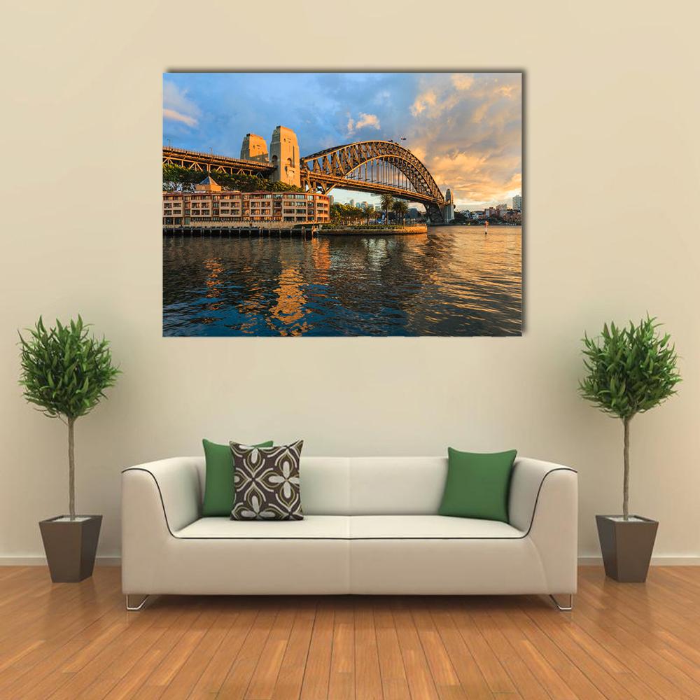 Sydney Harbour Bridge at Sunset Canvas Wall Art in orange, yellow and blue, single panel hung on a wall