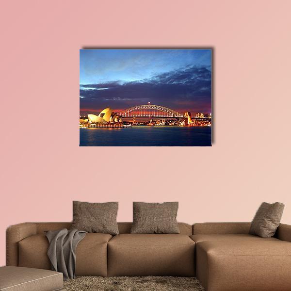 Sydney Harbour Bridge and Opera House at Dusk Canvas Wall Art in orange, blue and navy, single panel hung on a wall