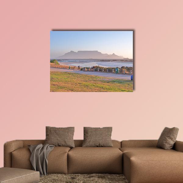 Table Mountain Seen from Big Bay Beach Canvas Wall Art in beige, green and blue, single panel hung on a wall