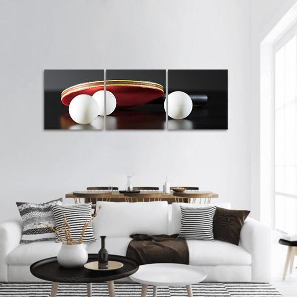 Table Tennis Paddle and Balls Panoramic Canvas Wall Art in black, white and red, hung on a wall