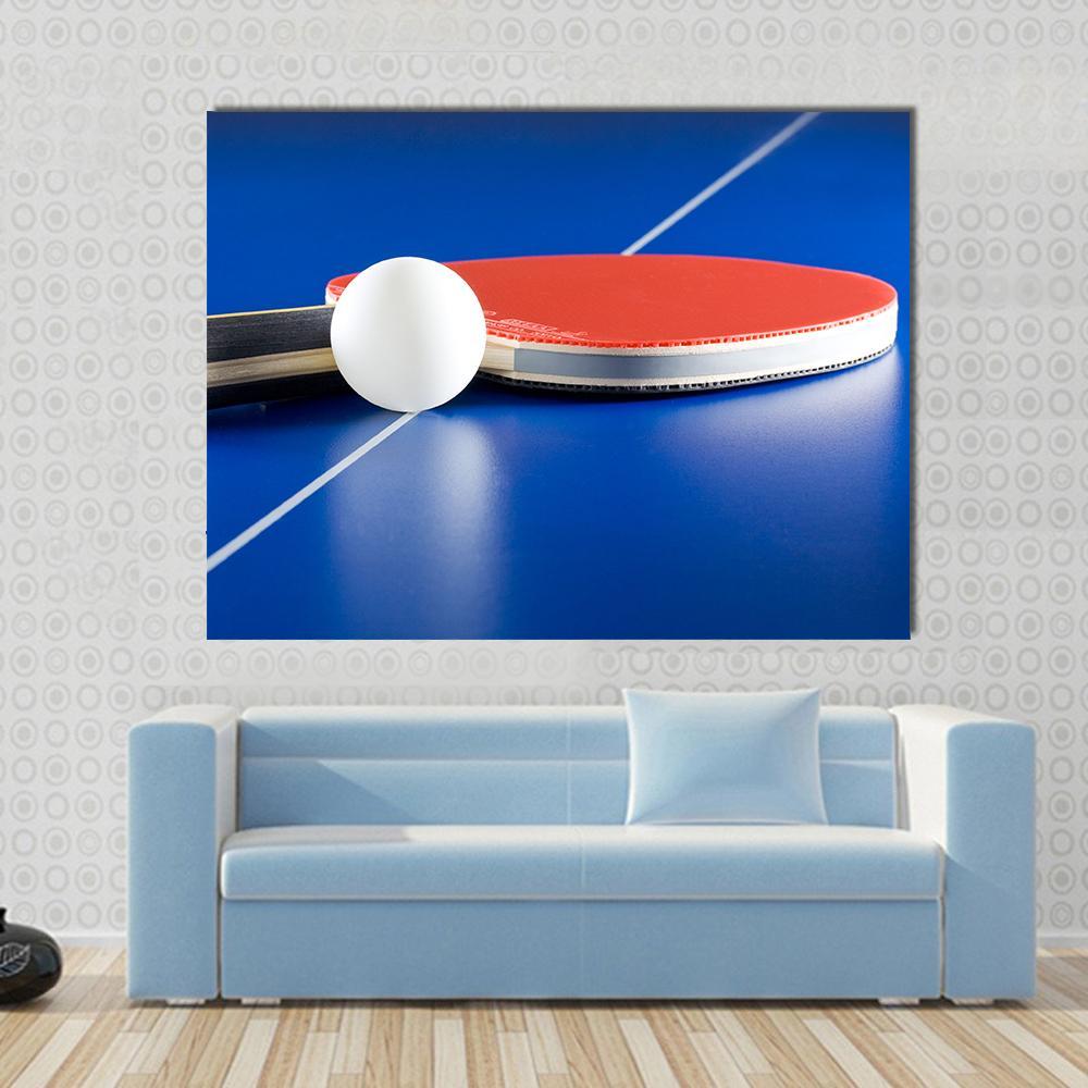 Table Tennis Racket &amp; Ball Canvas Wall Art in white, red and blue, single panel hung on a wall