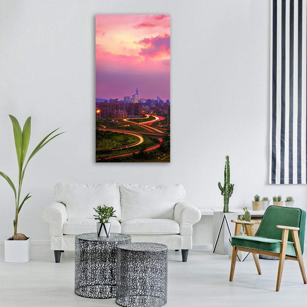 Taipei Highway Light Trails Vertical Canvas Wall Art in orange, purple and pink, single vertical panel hung on a wall