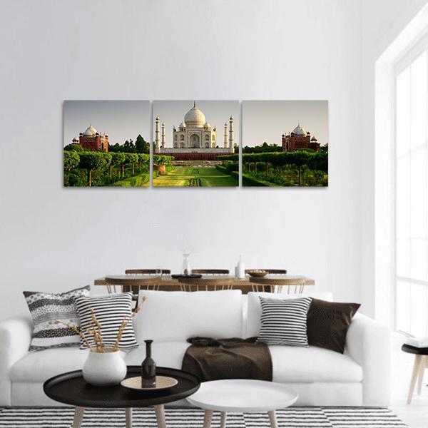 Taj Mahal from the Gardens Panoramic Canvas Wall Art in white, gray and green, hung on a wall