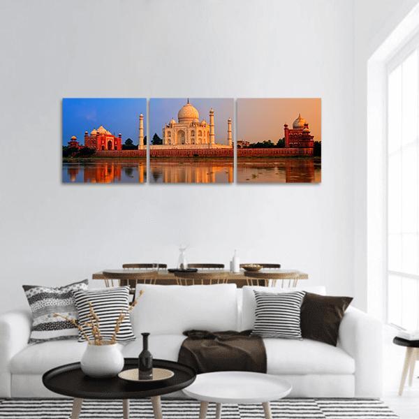 Taj Mahal Reflection on Yamuna River Panoramic Canvas Wall Art in white, orange and blue, hung on a wall