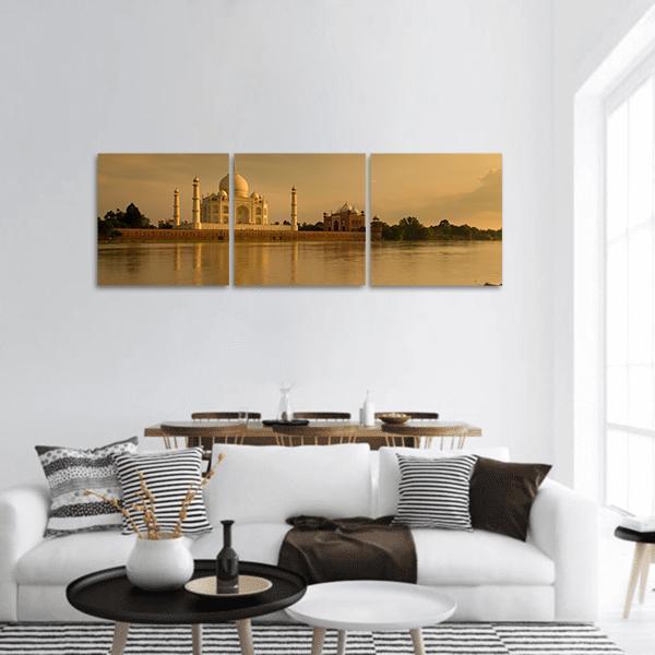 Taj Mahal at Sunset Panoramic Canvas Wall Art in gold, orange and yellow, hung on a wall