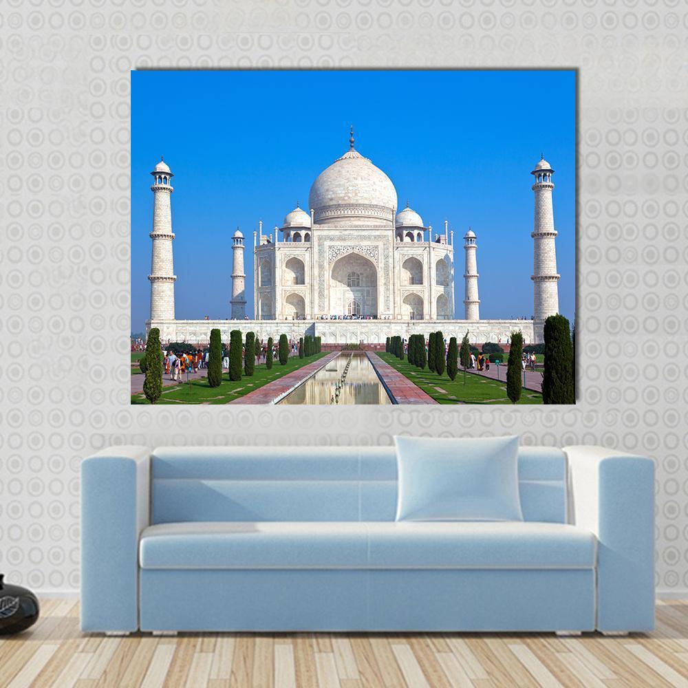 Taj Mahal Reflecting Pool Canvas Wall Art in white and blue, single panel hung on a wall