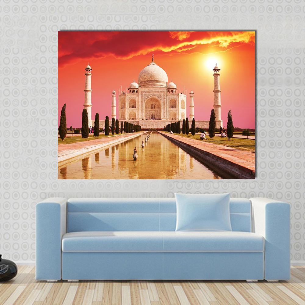 Taj Mahal Reflecting Pool at Sunset Canvas Wall Art in red, orange and yellow, single panel hung on a wall