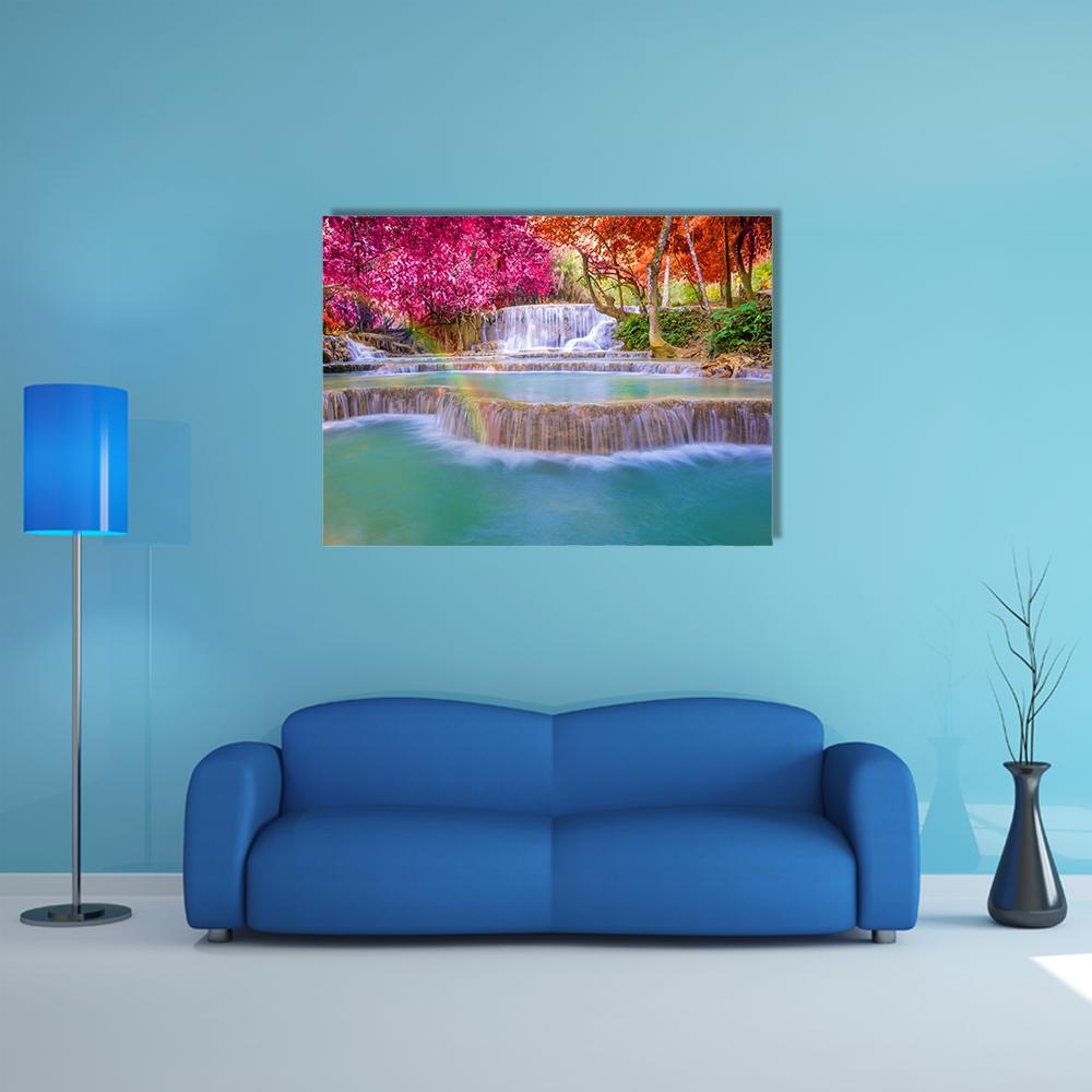 Tat Kuang Si Waterfalls Canvas Wall Art in green, blue and pink, single panel hung on a wall