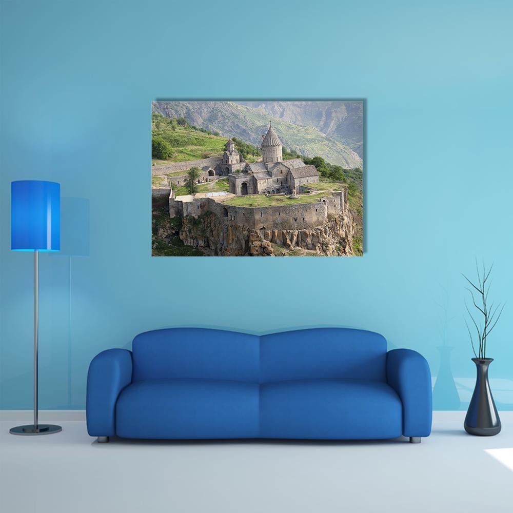 Tatev Monastery on Steep Cliffs Canvas Wall Art in gray, brown and green, single panel hung on a wall