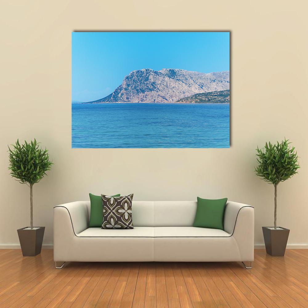 Tavolara Island on a Clear Day Canvas Wall Art in gray, beige and blue, single panel hung on a wall