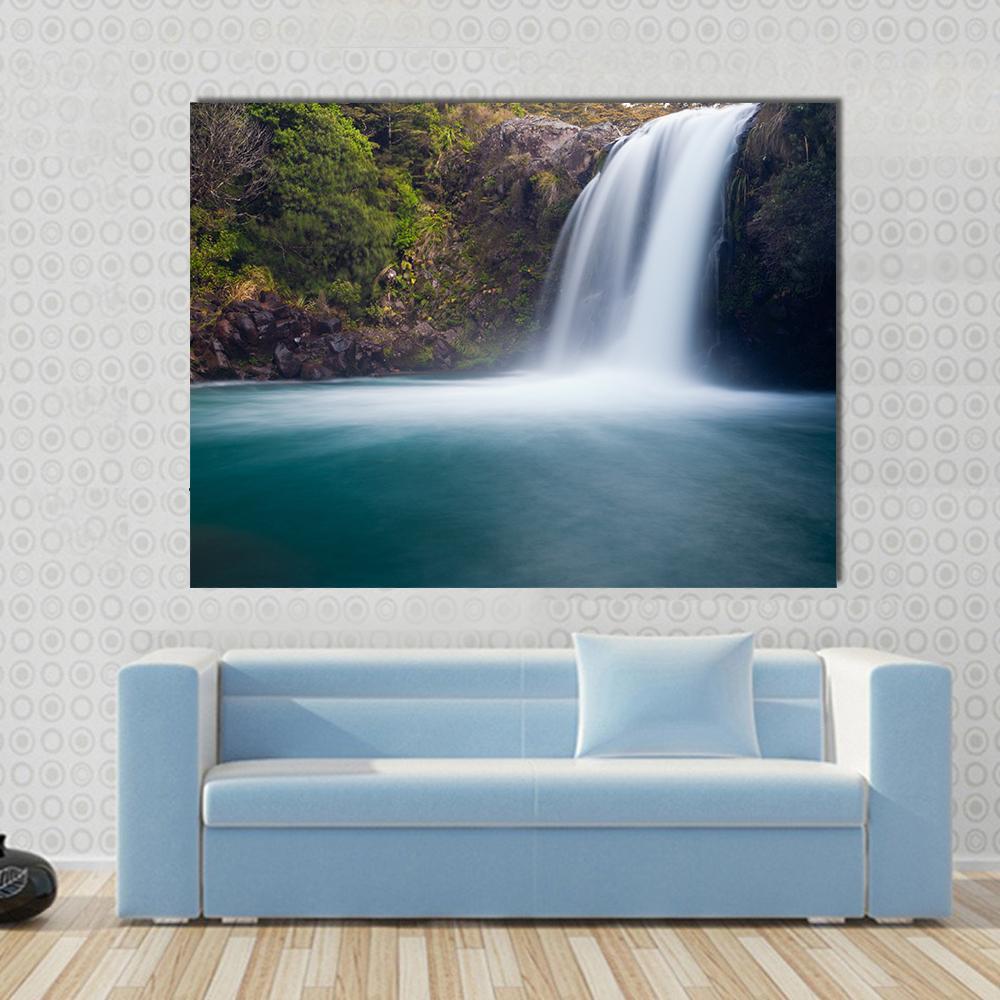 Tawhai Waterfall New Zealand Canvas Wall Art in white, green and blue, single panel hung on a wall