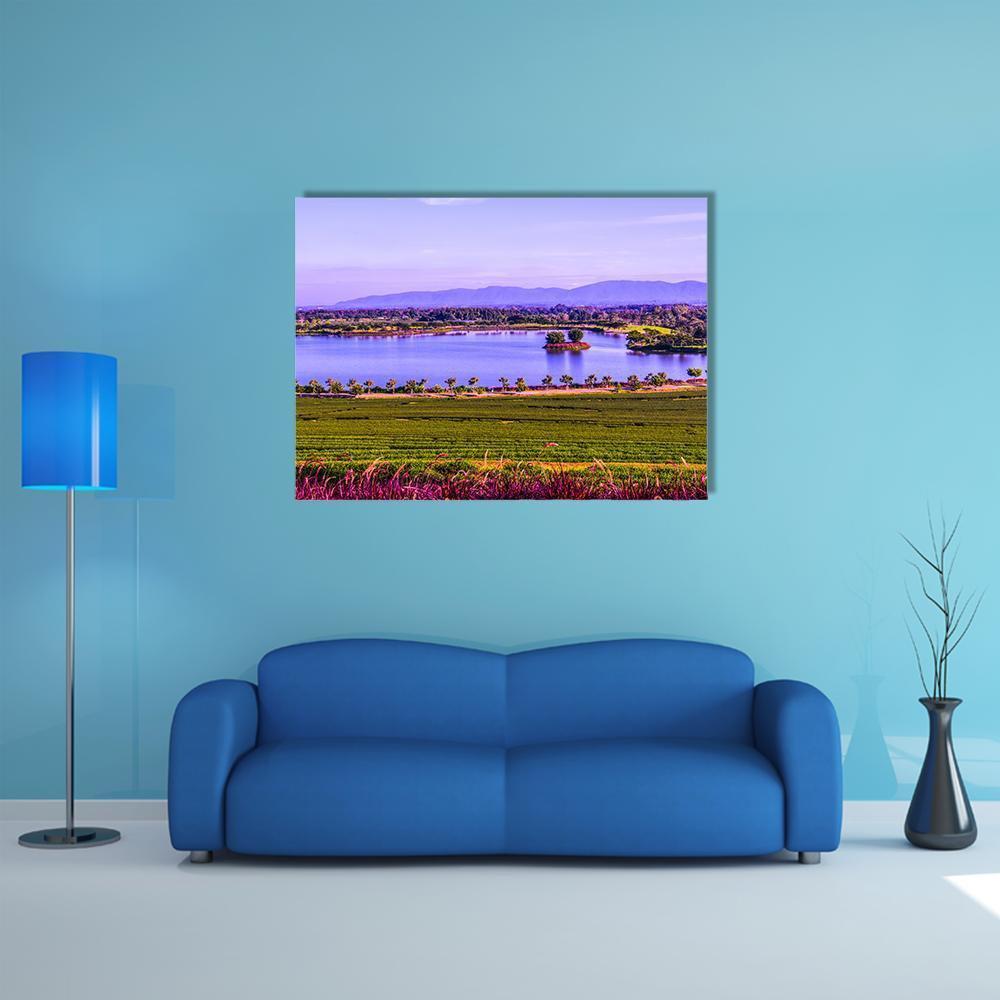 Tea Plantation by a Lake Canvas Wall Art in green, blue and purple, single panel hung on a wall