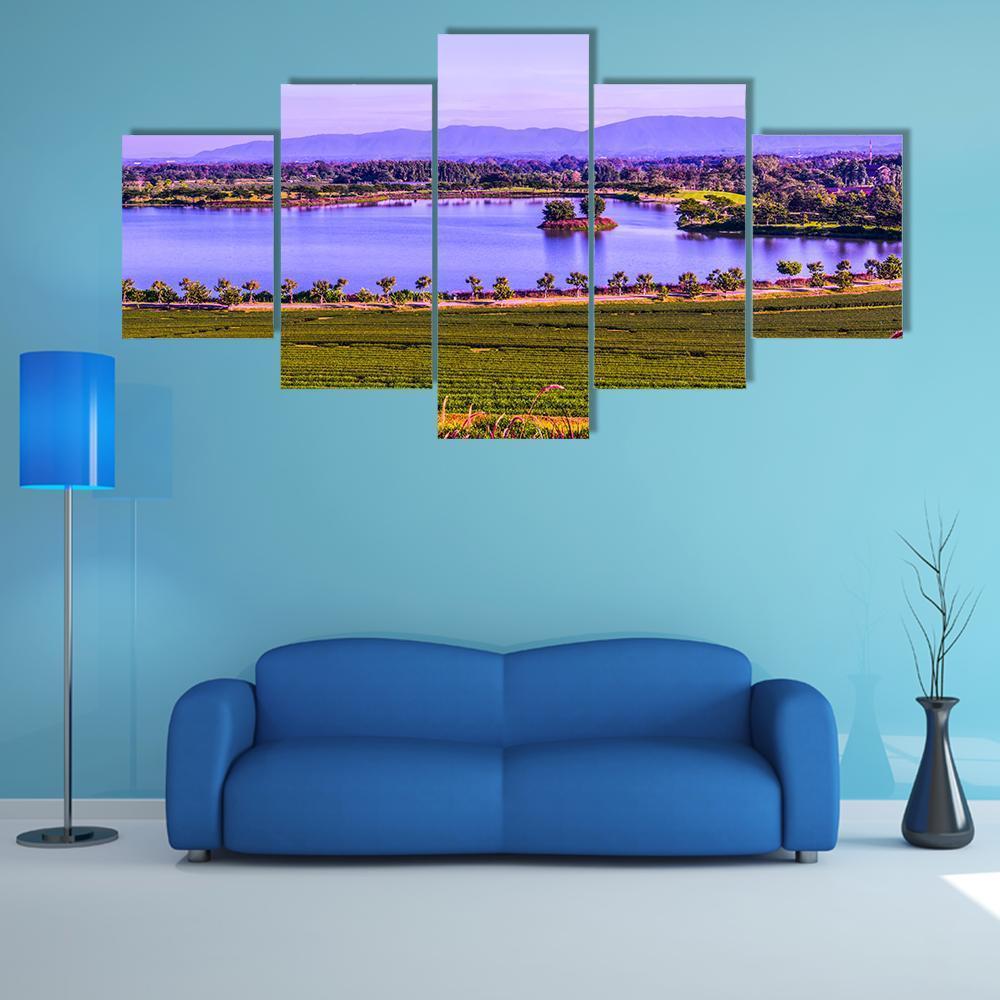 Tea Plantation by a Lake Canvas Wall Art in green, blue and purple, 5 panel Star layout hung on a wall