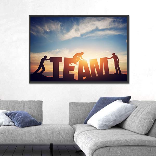 Team Lettering with Silhouetted Figures Canvas Wall Art in black, orange and blue, framed canvas, product view on a white background