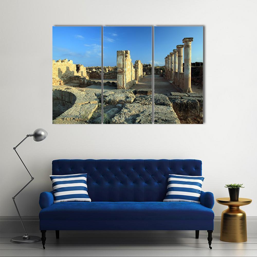 Temple Columns in Paphos Canvas Wall Art in beige, brown and blue, 3 panel horizontal set hung on a wall