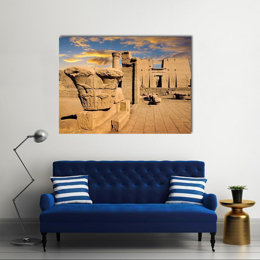 Ancient Egyptian Temple Ruins at Sunset Canvas Wall Art in brown, yellow and blue, single panel hung on a wall