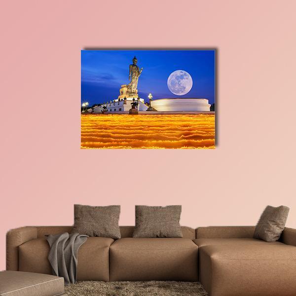 Buddha Temple Under Full Moon Canvas Wall Art in orange, yellow and blue, single panel hung on a wall