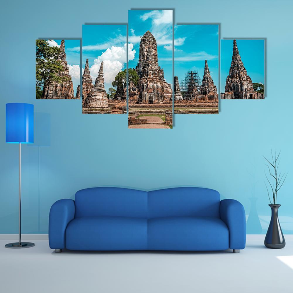 Ancient Temple Ruins on a Sunny Day Canvas Wall Art in beige, brown and blue, 5 panel Star layout hung on a wall