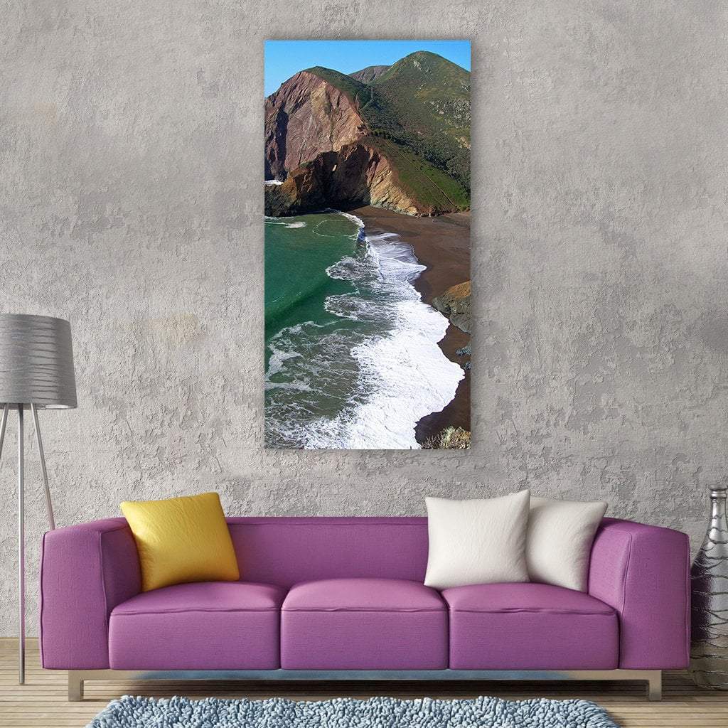Tennessee Cove Coastal Cliffs and Dark Sand Beach Vertical Canvas Wall Art in brown, green and blue, single vertical panel hung on a wall