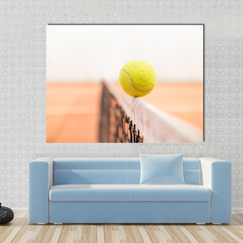 Tennis Ball Hitting Net Canvas Wall Art in white, orange and yellow, single panel hung on a wall