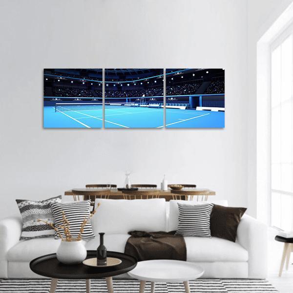 Illuminated Tennis Court at Night Panoramic Canvas Wall Art in black and blue, hung on a wall