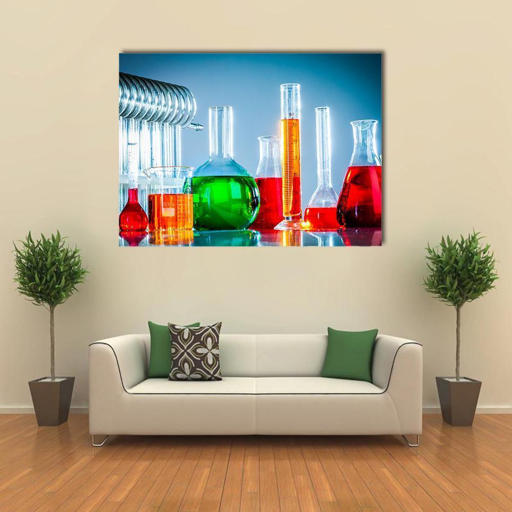 Colorful Test Tubes and Beakers Canvas Wall Art in blue and multicolor, single panel hung on a wall