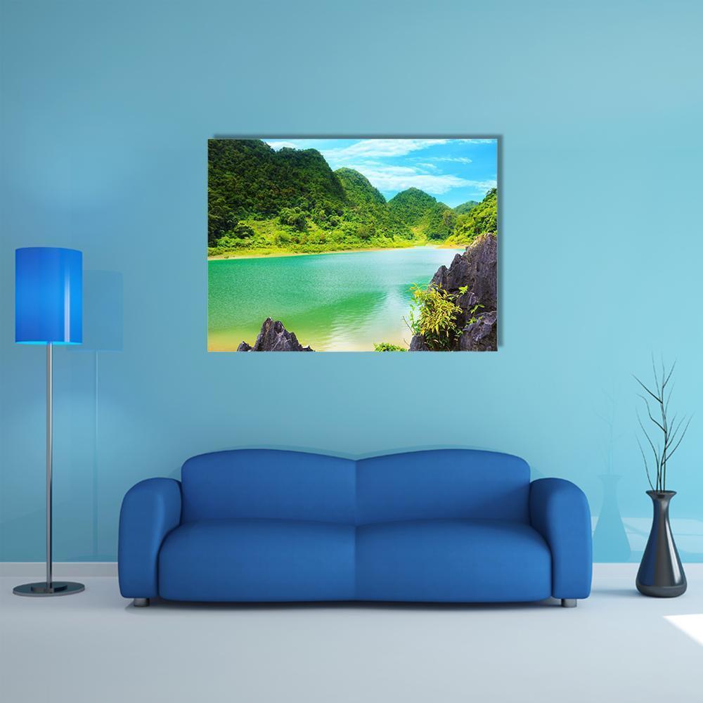 Thang Hen Lake Turquoise Shoreline Canvas Wall Art in green and blue, single panel hung on a wall