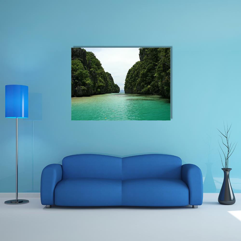 El Nido Turquoise Lagoon Canvas Wall Art in green and blue, single panel hung on a wall