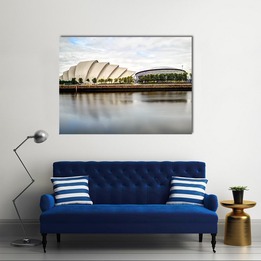 Armadillo Auditorium Glasgow River Reflection Canvas Wall Art in gray, silver and blue, single panel hung on a wall