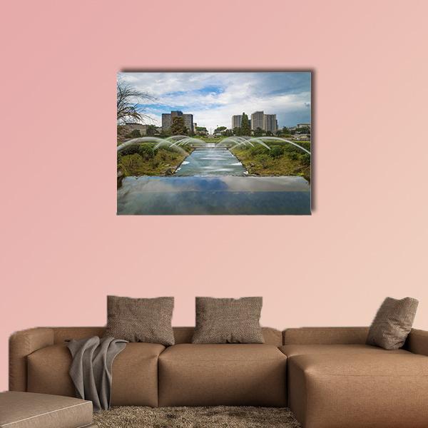 Artificial Waterfall in Rome Canvas Wall Art in gray, green and blue, single panel hung on a wall