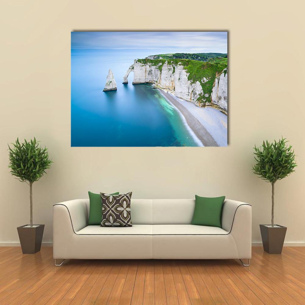 Aval Cliff Natural Arch Canvas Wall Art in white, green and blue, single panel hung on a wall