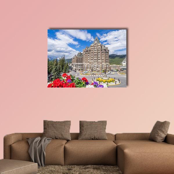 Banff Springs Hotel Canvas Wall Art in gray, brown and blue, single panel hung on a wall