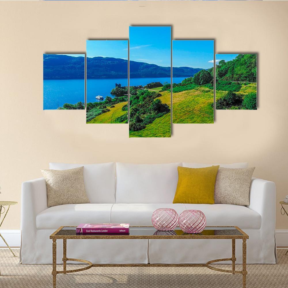 Blue Water of Loch Ness Canvas Wall Art in green and blue, 5 panel Star layout hung on a wall