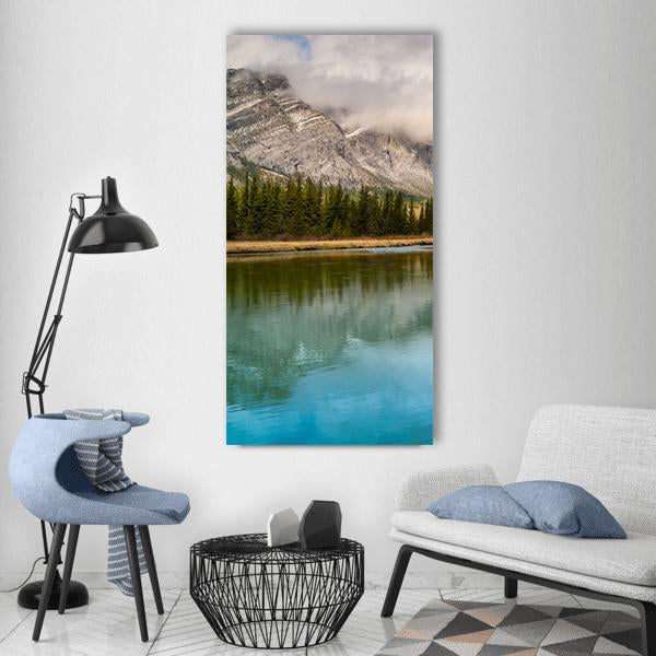Bow River Reflections Vertical Canvas Wall Art in gray, green and blue, single vertical panel hung on a wall