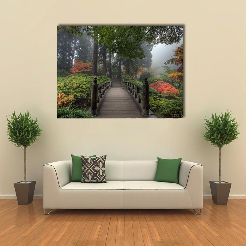 Wooden Arched Bridge in Autumn Fog Canvas Wall Art in gray, brown and green, single panel hung on a wall