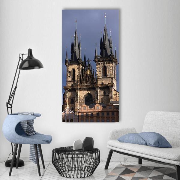 Cathedral Tower in Prague Vertical Canvas Wall Art in gray, brown and blue, single vertical panel hung on a wall