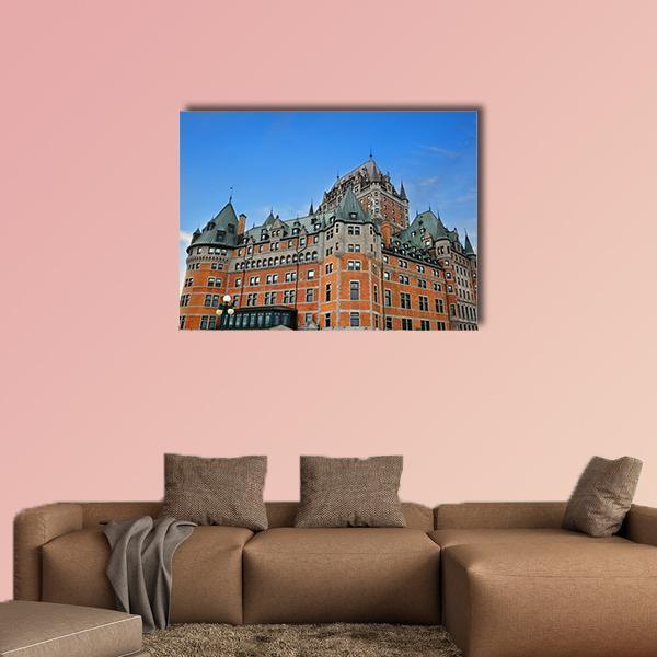 Fairmont Le Chateau Frontenac Canvas Wall Art in brown, orange and blue, single panel hung on a wall