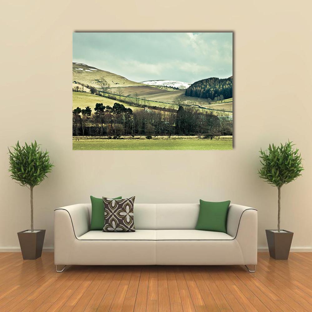 Cheviot Hills Landscape Canvas Wall Art in brown, green and blue, single panel hung on a wall
