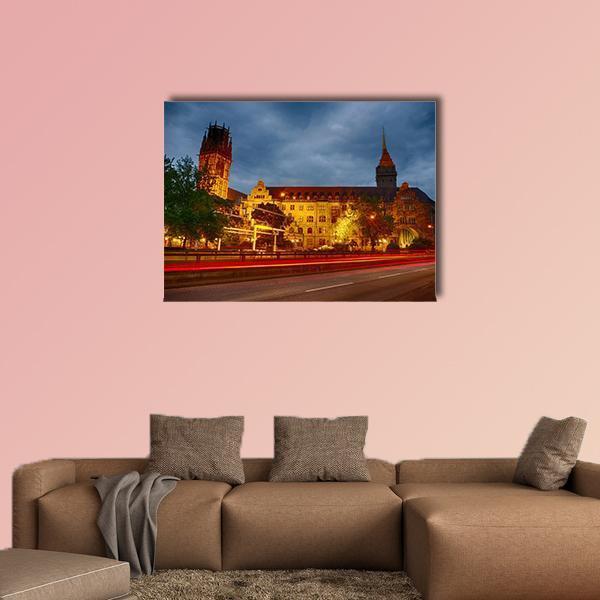 City Hall of Duisburg at Night Canvas Wall Art in orange, yellow and blue, single panel hung on a wall