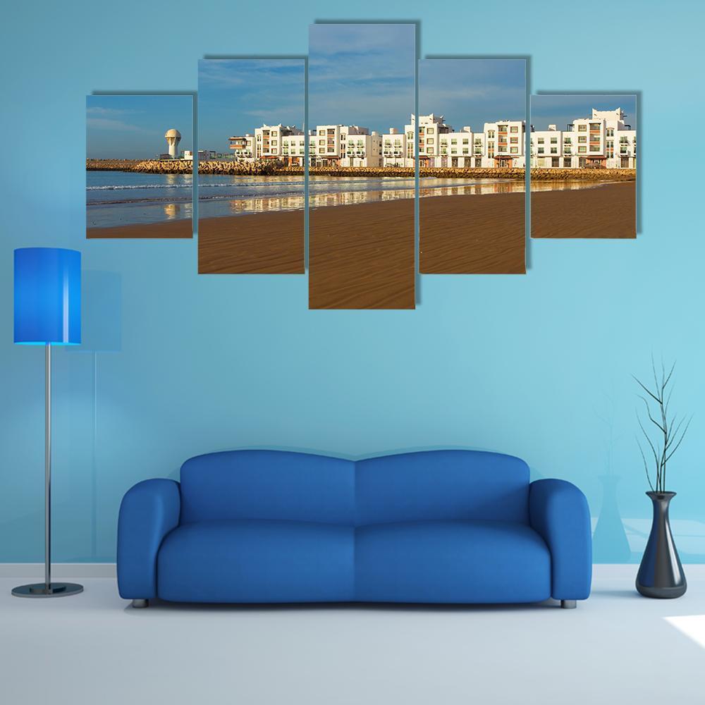 Agadir Coastal Cityscape Canvas Wall Art in white, brown and blue, 5 panel Star layout hung on a wall