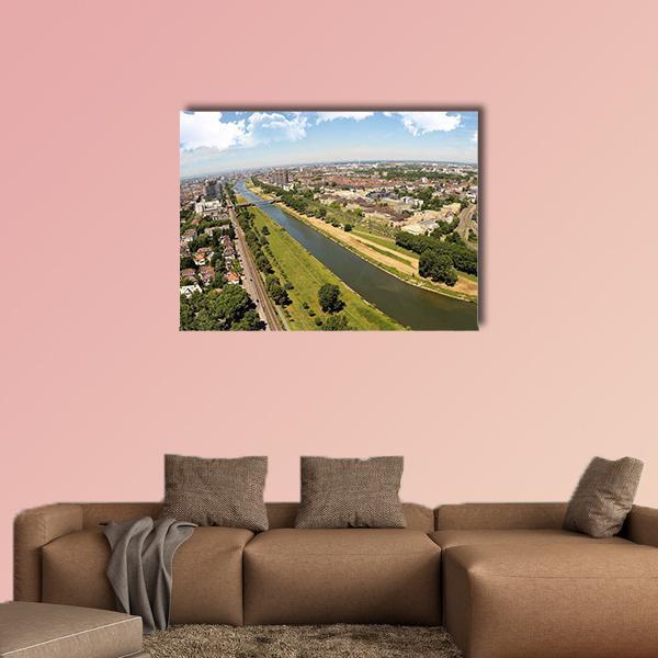 Mannheim Cityscape Over the River Canvas Wall Art in brown, green and blue, single panel hung on a wall