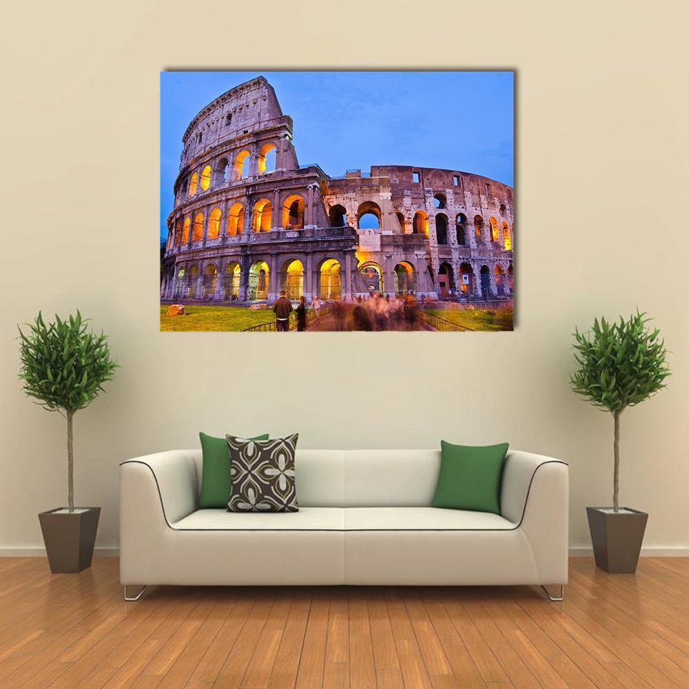 Colosseum at Night Canvas Wall Art in brown, orange and blue, single panel hung on a wall