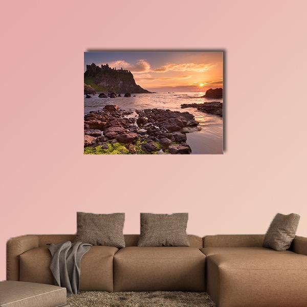 Dunluce Castle Cliffside at Sunset Canvas Wall Art in brown, orange and purple, single panel hung on a wall