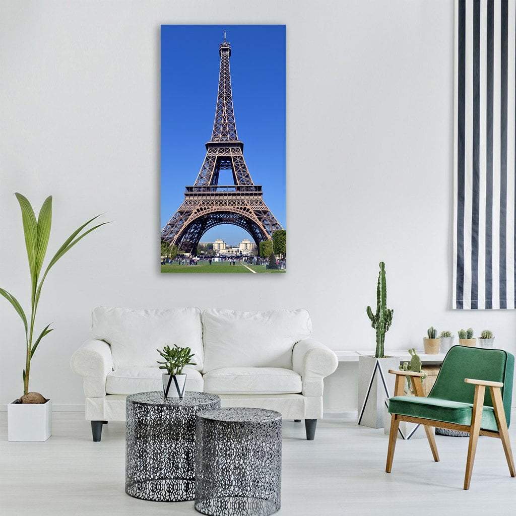 Eiffel Tower in Paris Vertical Canvas Wall Art in gray, brown and blue, hung on a wall