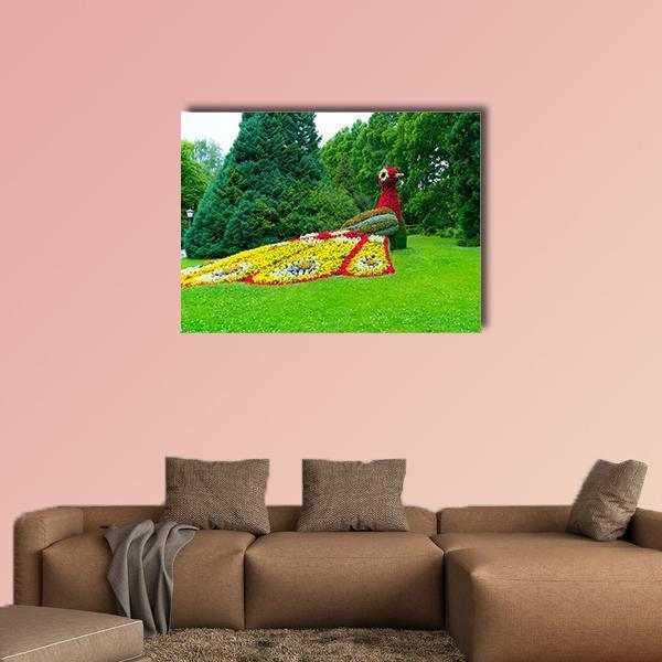 Peacock Made of Flowers Canvas Wall Art in red, yellow and green, single panel hung on a wall