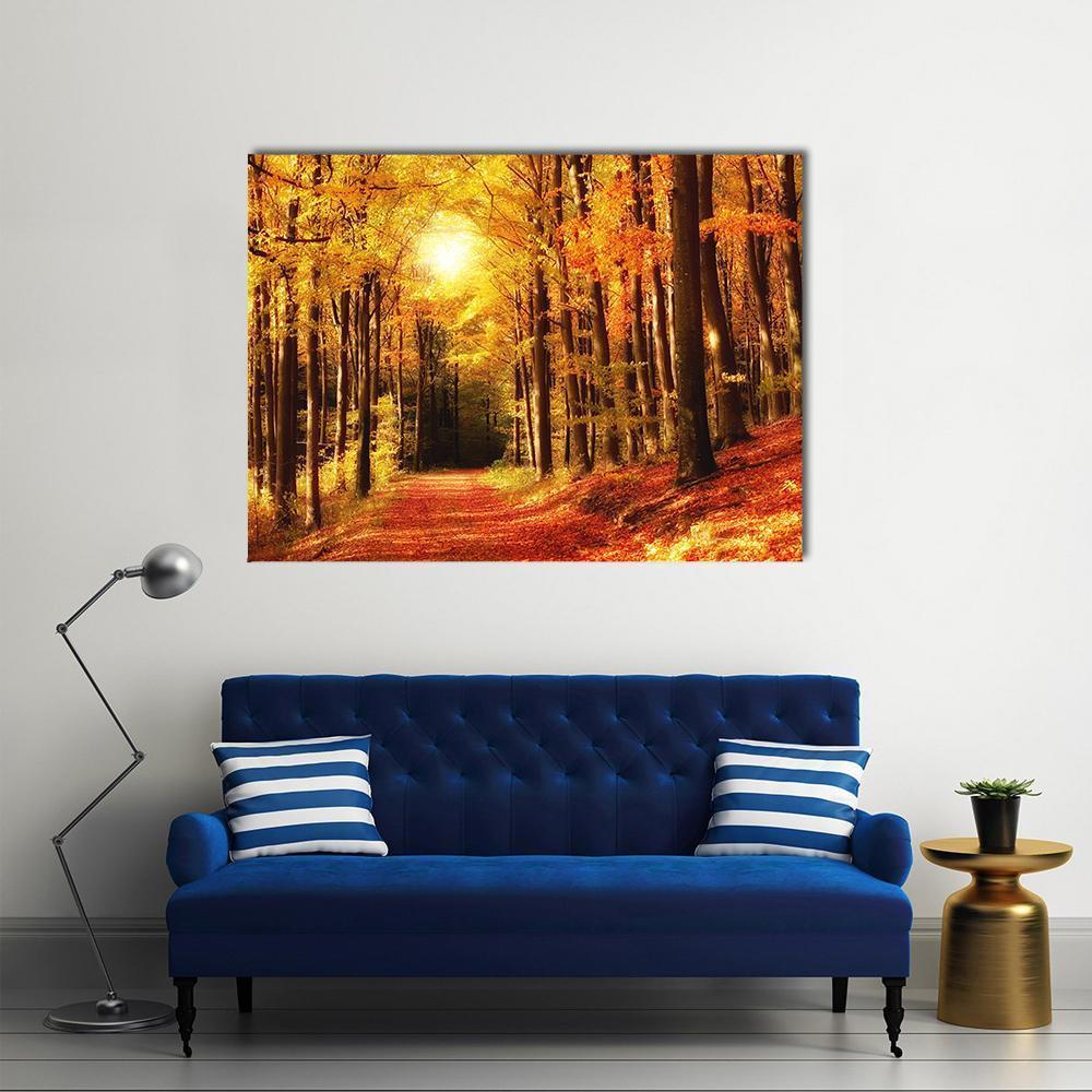 Autumn Forest Path Canvas Wall Art in brown, orange and yellow, single panel hung on a wall