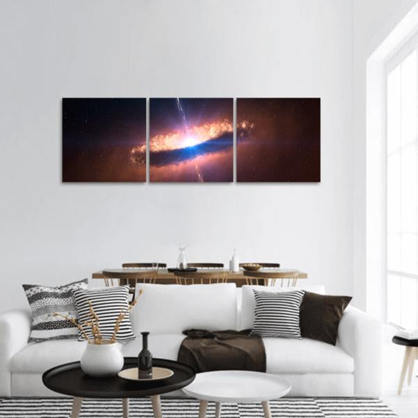 Galaxy System with Bright Central Light Panoramic Canvas Wall Art in black, orange and blue, hung on a wall