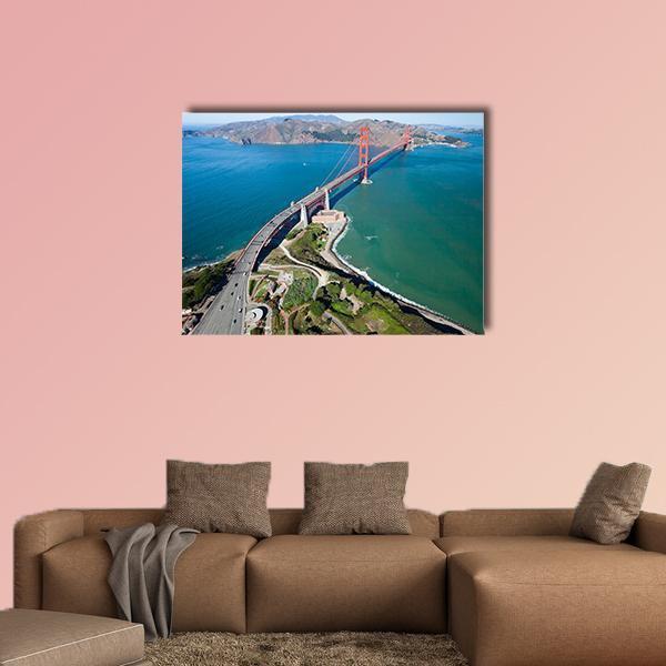 Golden Gate Bridge Aerial View Canvas Wall Art in orange, green and blue, single panel hung on a wall