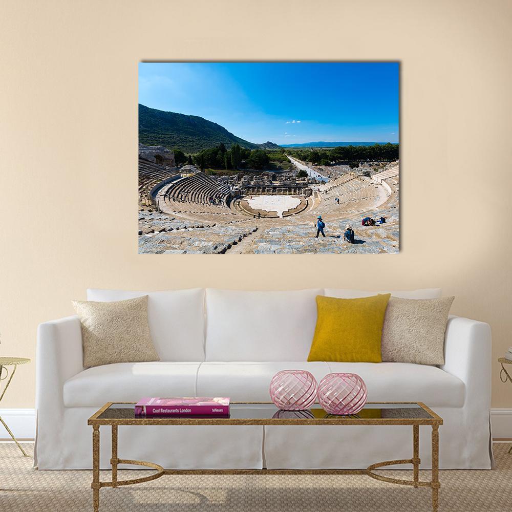 Grand Ancient Amphitheater Photograph Canvas Wall Art in gray, beige and blue, single panel hung on a wall